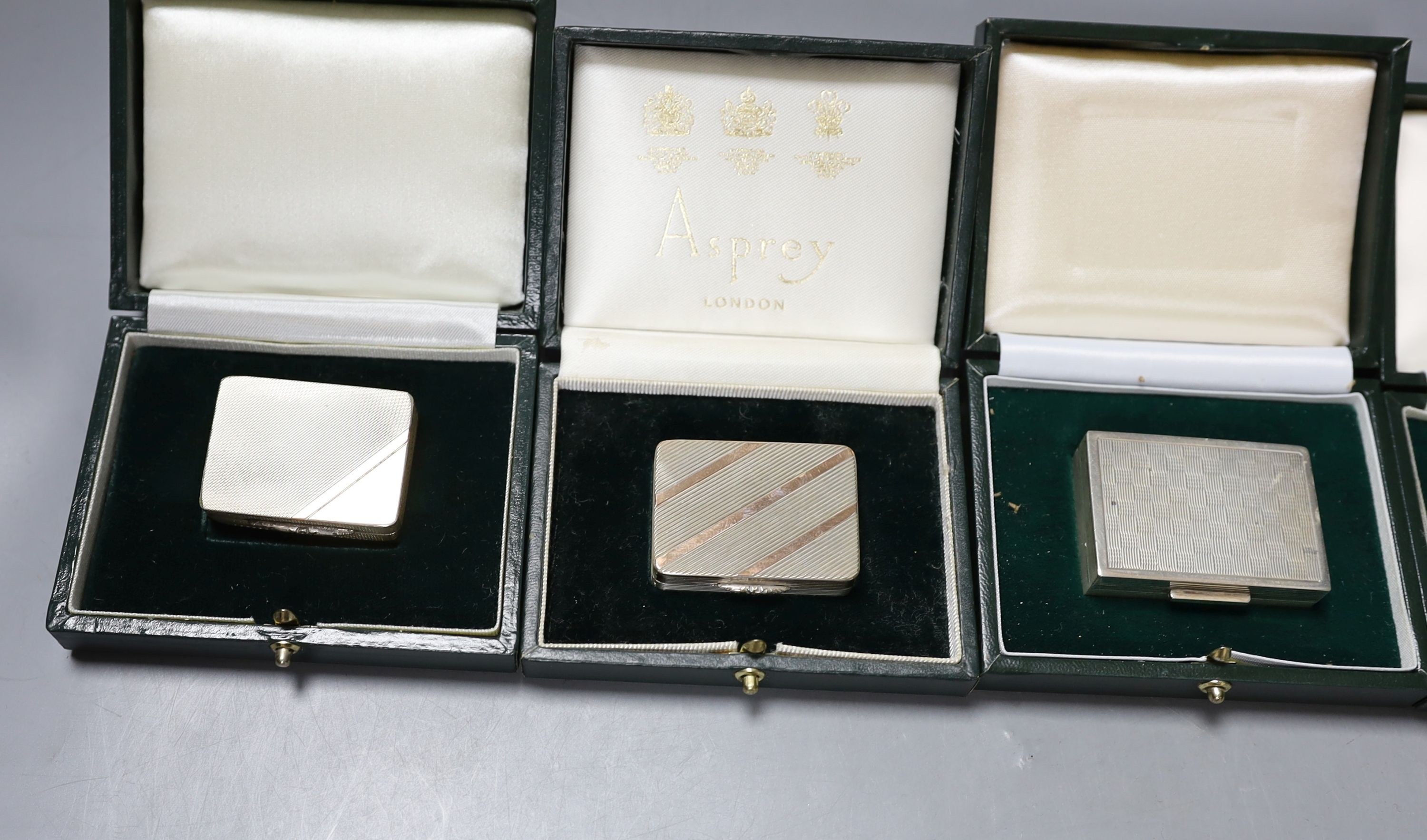 Six assorted modern silver or parcel gilt silver pill boxes by Peter John Doherty, Birmingham, 1965-2000 largest 52mm, all in fitted Gallagher boxes, one by Asprey.